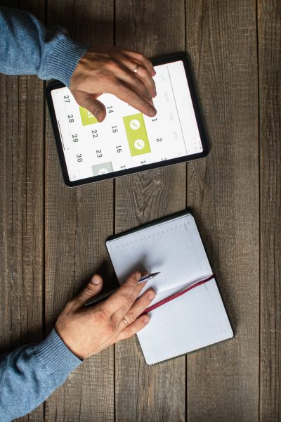 partial image of someone schedule an appointment on their calendar